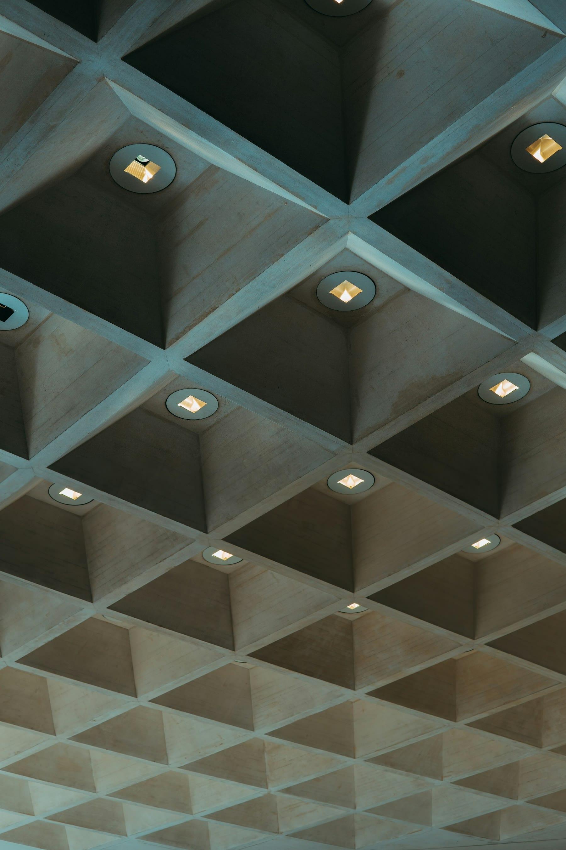 Close-up of a modern ceiling with layered light fixtures